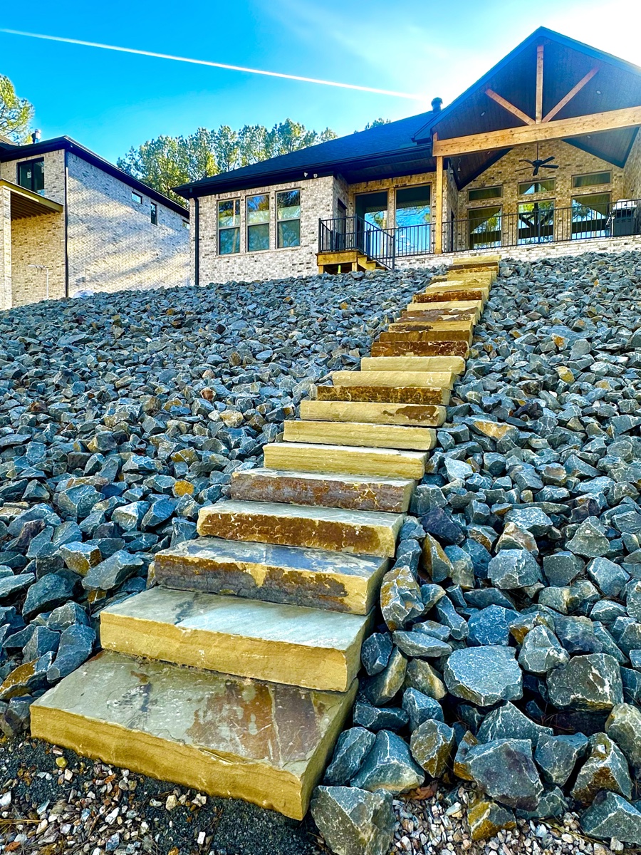 Natural-stone slab steps set into a slope