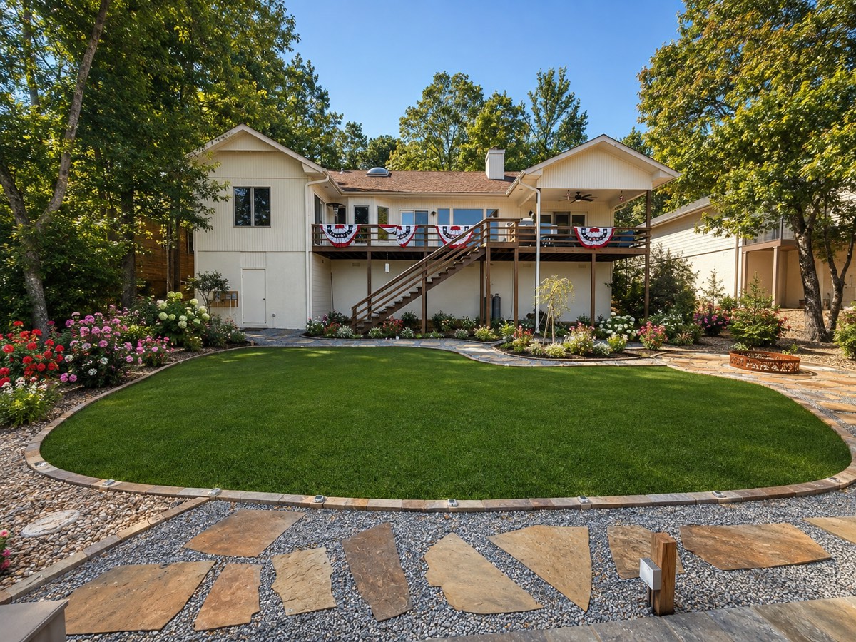 Same view after β artificial-turf lawn, native stone, flagstone paths, fire pit and lighting